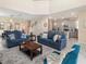 Expansive living room with open layout to dining and kitchen, featuring lots of light at 8938 Cabot Cliffs Dr, Davenport, FL 33896