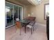 Cozy covered patio with comfortable seating, perfect for relaxing and enjoying the outdoor space at 8938 Cabot Cliffs Dr, Davenport, FL 33896
