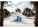 Fun water park with a slide, splash pad, and lounge chairs perfect for Gathering enjoyment at 8938 Cabot Cliffs Dr, Davenport, FL 33896