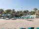 Large pool area with surrounding lounge chairs and umbrellas for a relaxing day in the sun at 8938 Cabot Cliffs Dr, Davenport, FL 33896