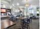 The restaurant offers an inviting atmosphere to dine with large windows, modern lighting, and comfortable seating at 8938 Cabot Cliffs Dr, Davenport, FL 33896