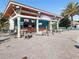 The Oasis Tiki Bar with outdoor seating and TVs offers a refreshing space to relax by the pool at 8938 Cabot Cliffs Dr, Davenport, FL 33896