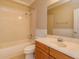 Well-lit bathroom features a tub-shower combination and a vanity with wooden cabinetry at 2072 Hartz Aly, Orlando, FL 32814