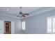 Large bedroom with a trey ceiling, ceiling fan and natural light from two windows at 2072 Hartz Aly, Orlando, FL 32814