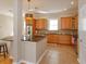 Stylish kitchen with granite countertops, wood cabinets, and stainless steel appliances at 2072 Hartz Aly, Orlando, FL 32814