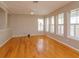 Spacious living room features hardwood floors, and many windows at 2072 Hartz Aly, Orlando, FL 32814