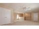 Spacious loft area with neutral carpeting, closet and stairs with white railings at 2072 Hartz Aly, Orlando, FL 32814
