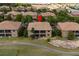 A lovely two-story condo with a screened-in lanai, located next to a community golf green at 8930 Azalea Sands Ln, Davenport, FL 33896