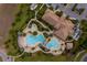 Aerial view of community pool, clubhouse, and surrounding landscaping at 8930 Azalea Sands Ln, Davenport, FL 33896