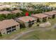 Aerial view of community townhomes on lush green surroundings at 8930 Azalea Sands Ln, Davenport, FL 33896