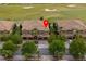 Aerial view of a townhome featuring mature landscaping with a golf course nearby at 8930 Azalea Sands Ln, Davenport, FL 33896