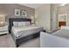 Comfortable bedroom features king bed, daybed, stylish decor, and serene ambiance for a restful stay at 8930 Azalea Sands Ln, Davenport, FL 33896