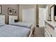 Cozy bedroom features two twin beds, closet, and modern decor for a comfortable and stylish stay at 8930 Azalea Sands Ln, Davenport, FL 33896