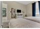 Relaxing bedroom with two twin beds, a TV, and a soothing color scheme for a peaceful retreat at 8930 Azalea Sands Ln, Davenport, FL 33896