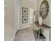 Light and bright entryway featuring tile floors and a decorative mirror at 8930 Azalea Sands Ln, Davenport, FL 33896