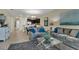 Inviting living room with neutral tones, comfortable seating, and a well-lit, airy ambiance at 8930 Azalea Sands Ln, Davenport, FL 33896