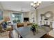 Spacious living and dining area with an open floor plan and large windows providing ample natural light at 8930 Azalea Sands Ln, Davenport, FL 33896