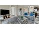 Comfortable living room featuring a large TV, neutral decor, and an open floor plan for modern living at 8930 Azalea Sands Ln, Davenport, FL 33896