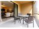Inviting outdoor patio with dining table and view of indoor space at 8930 Azalea Sands Ln, Davenport, FL 33896