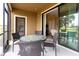 Inviting outdoor patio with dining table and view of the yard at 8930 Azalea Sands Ln, Davenport, FL 33896