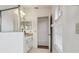 This bathroom features a vanity with granite countertops, neutral tile, and a glass-enclosed shower at 1546 Thornhill Cir, Oviedo, FL 32765