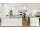 Open kitchen with gray cabinets, stainless steel appliances, and large center island at 1546 Thornhill Cir, Oviedo, FL 32765