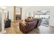 Living room with brick fireplace and sliding glass doors to outdoor area at 1546 Thornhill Cir, Oviedo, FL 32765