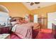 Comfortable main bedroom with a ceiling fan, en-suite bathroom access, and natural light at 1546 Thornhill Cir, Oviedo, FL 32765