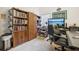 Home office with built-in shelving and a large desk area, perfect for working from home at 1546 Thornhill Cir, Oviedo, FL 32765
