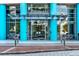 Modern building entrance featuring blue columns and a glass facade with 'The Waverly' signage above at 322 E Central Blvd # 901, Orlando, FL 32801