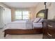 Comfortable bedroom featuring neutral decor and natural light at 3276 Candle Ridge Ct # 202, Orlando, FL 32822