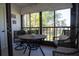 Relaxing lanai area with wicker furniture, offering a peaceful spot to enjoy the scenic outdoor views at 3276 Candle Ridge Ct # 202, Orlando, FL 32822