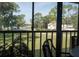 View from the enclosed lanai offers a pleasant view of the community's well-manicured grounds at 3276 Candle Ridge Ct # 202, Orlando, FL 32822