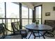 Enclosed lanai with comfortable seating, perfect for enjoying the outdoors in any weather at 3276 Candle Ridge Ct # 202, Orlando, FL 32822