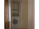 A stacked washer and dryer setup, conveniently tucked away behind a curtain at 3276 Candle Ridge Ct # 202, Orlando, FL 32822