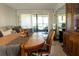 Inviting living and dining area featuring stylish furniture, a rug, and a view of the patio at 3276 Candle Ridge Ct # 202, Orlando, FL 32822