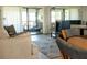 Comfortable living space with patio access, perfect for indoor-outdoor living at 3276 Candle Ridge Ct # 202, Orlando, FL 32822