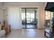 Open-concept living space with a sliding glass door that brings in an abundance of natural light at 3276 Candle Ridge Ct # 202, Orlando, FL 32822
