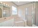 Bathroom featuring a bathtub and a shower stall at 2657 Queen Mary Pl, Maitland, FL 32751