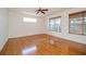 Spacious bedroom features natural light, neutral paint, and hardwood floors at 2657 Queen Mary Pl, Maitland, FL 32751