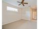 Spacious bedroom featuring a ceiling fan and a doorway at 2657 Queen Mary Pl, Maitland, FL 32751