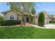 Charming single-story home featuring a well-manicured lawn, mature trees, and a welcoming facade at 2657 Queen Mary Pl, Maitland, FL 32751