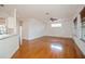 Open floor plan with hardwood floors and view of breakfast bar at 2657 Queen Mary Pl, Maitland, FL 32751