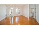 Bright living area features hardwood floors, a hanging chandelier, and plenty of natural light at 2657 Queen Mary Pl, Maitland, FL 32751
