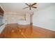 Open floor plan showcasing the living room and kitchen with hardwood floors and neutral paint at 2657 Queen Mary Pl, Maitland, FL 32751
