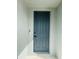 Gray front door with a smart lock and white trim at 291 Whistling Duck Trl, St Cloud, FL 34771
