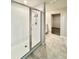 Modern bathroom features tiled walk-in shower and large walk-in closet with custom shelving at 291 Whistling Duck Trl, St Cloud, FL 34771