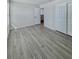 Bedroom features wood-look floors, closet, and ensuite bathroom at 291 Whistling Duck Trl, St Cloud, FL 34771