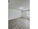 Bedroom with wood-look floors and large windows for ample light at 291 Whistling Duck Trl, St Cloud, FL 34771