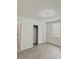 Bright bedroom with wood-look floors, closet and neutral paint scheme at 291 Whistling Duck Trl, St Cloud, FL 34771